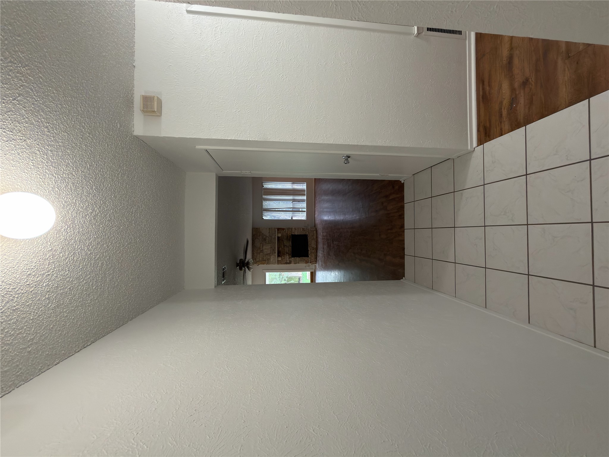 5601 Porsche Lane Austin, TX 78749 - Photo 25 of 38 a view of an empty room and a kitchen