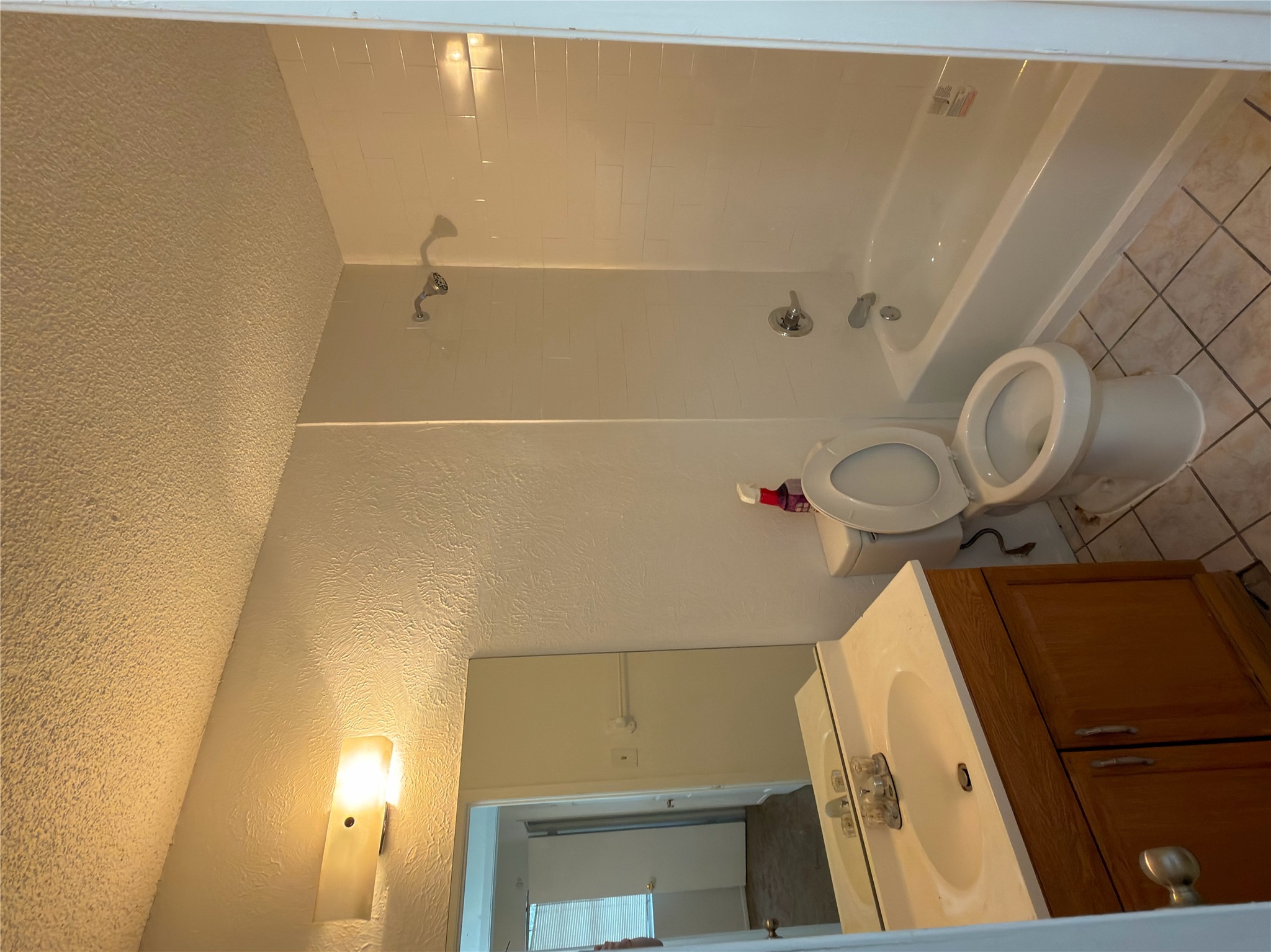 5601 Porsche Lane Austin, TX 78749 - Photo 27 of 38 a bathroom with a granite countertop sink toilet and shower