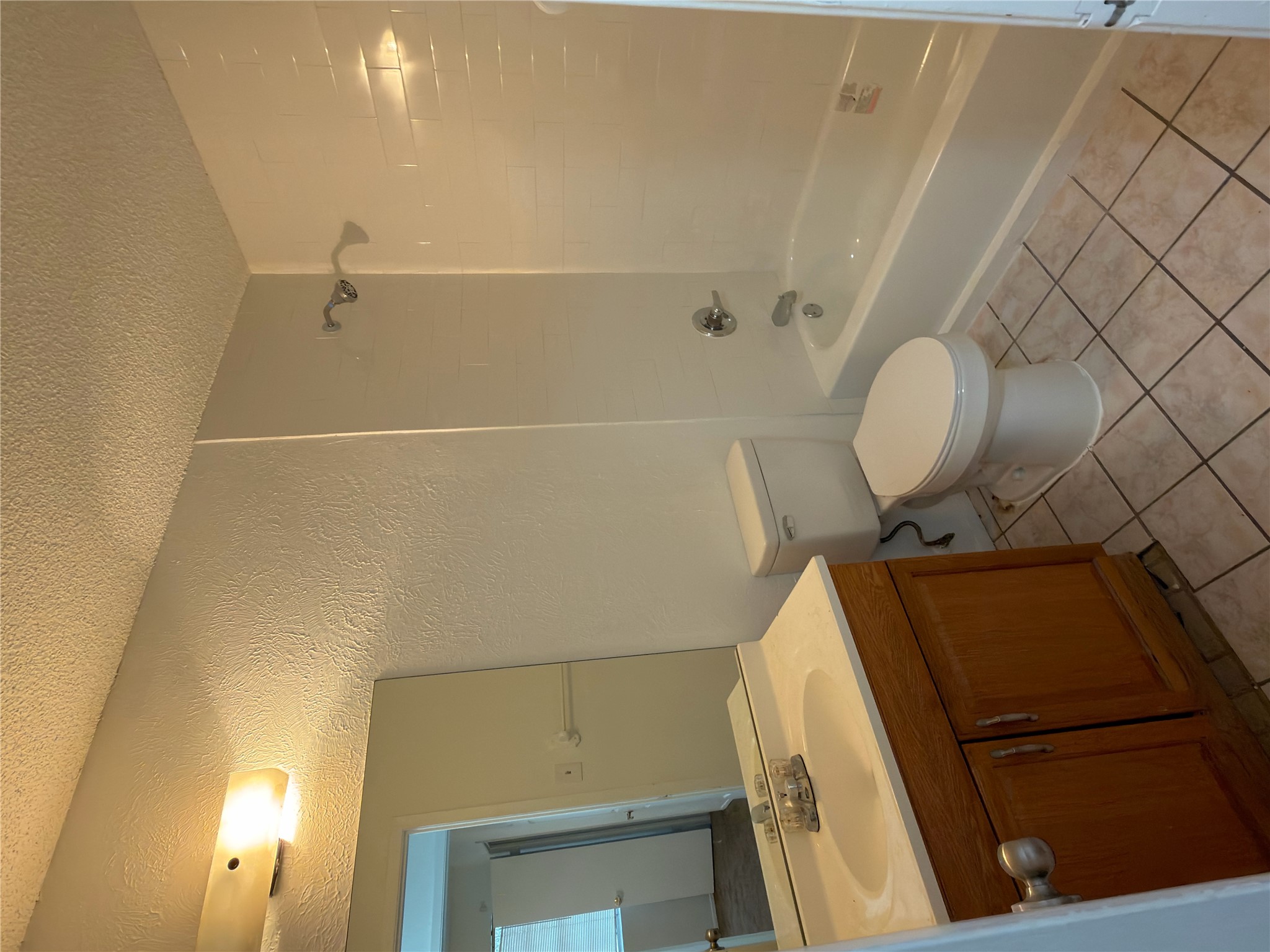 5601 Porsche Lane Austin, TX 78749 - Photo 28 of 38 a bathroom with a sink a toilet and shower