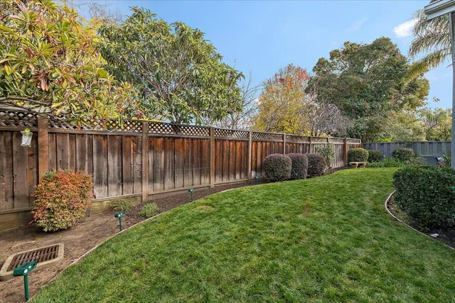 a backyard of a house with lots of green space