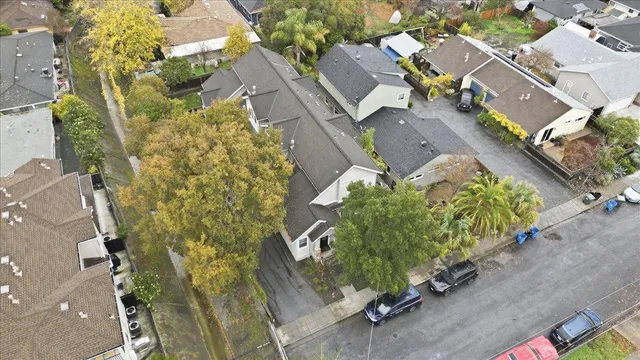 an aerial view of a houses with yard