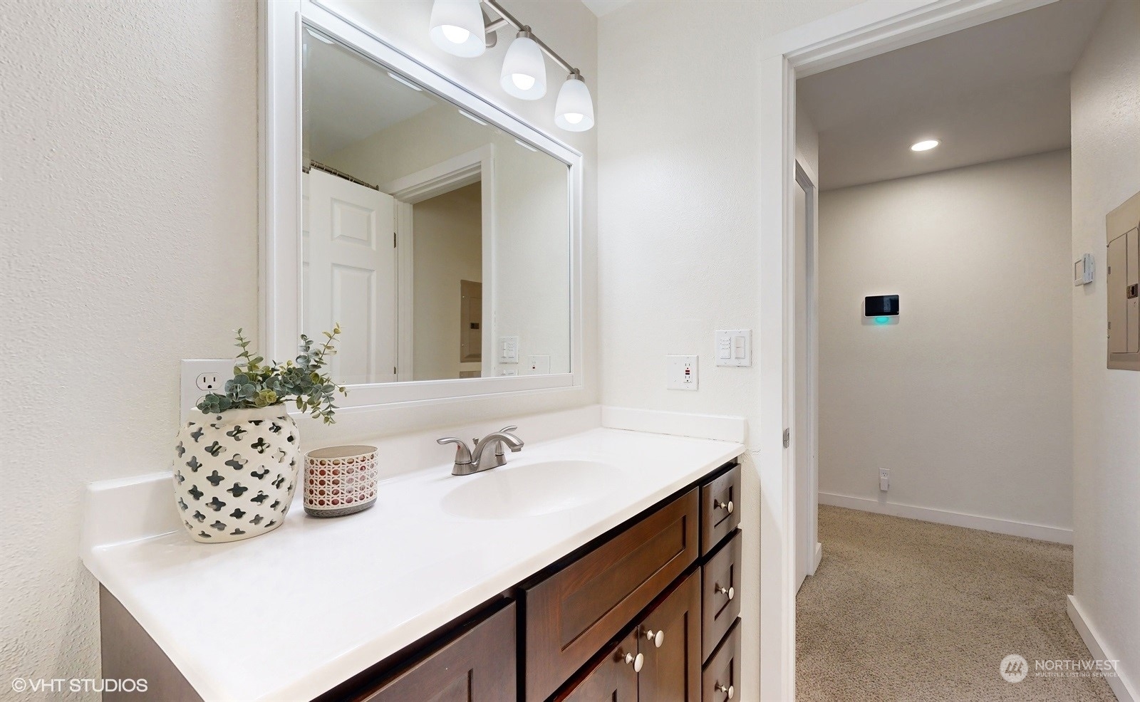 7933 191st Avenue Southwest Rochester, WA 98579 - Photo 24 of 36 a bathroom with a sink vanity and a mirror
