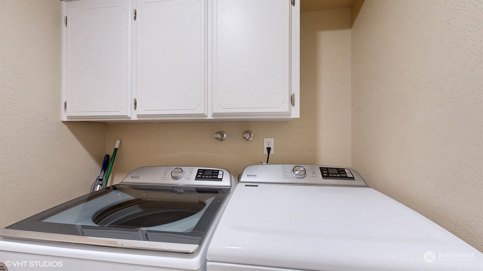 7933 191st Avenue Southwest Rochester, WA 98579 - Photo 28 of 36 a kitchen with a white stove top oven and cabinets
