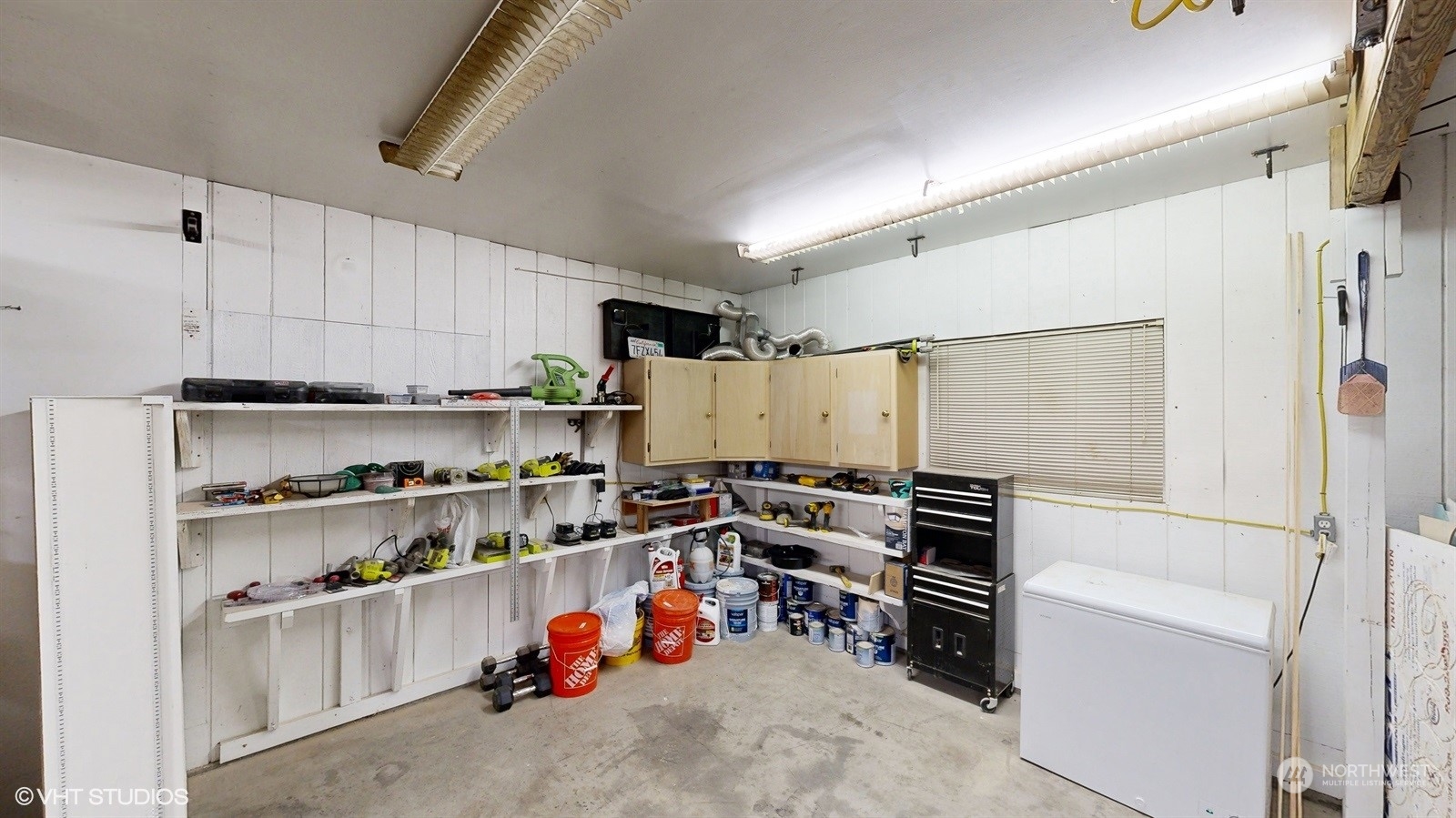 7933 191st Avenue Southwest Rochester, WA 98579 - Photo 31 of 36 a view of storage and utility room with racks shoes and chairs