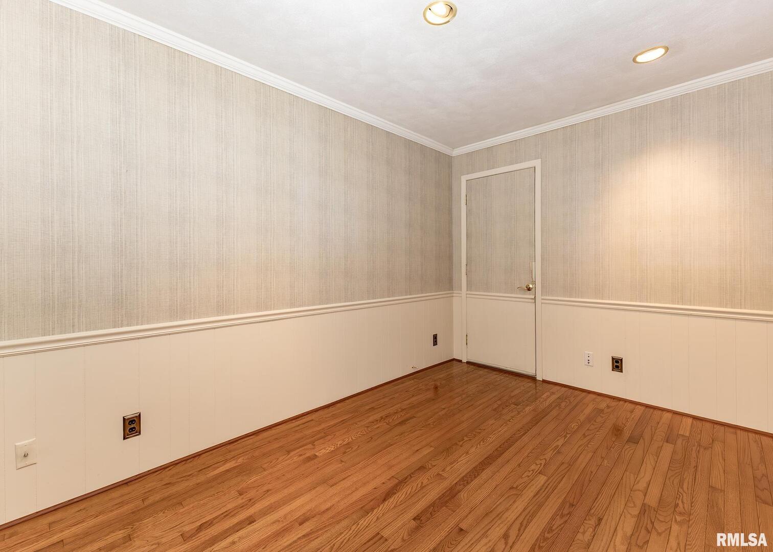 3407 41st Street Moline, IL 61265 - Photo 12 of 25 a view of an empty room with wooden floor