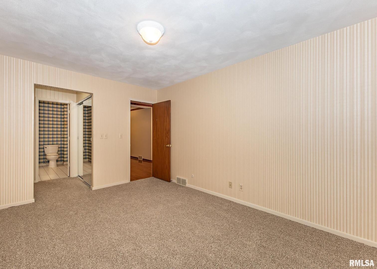 3407 41st Street Moline, IL 61265 - Photo 14 of 25 an empty room with closet