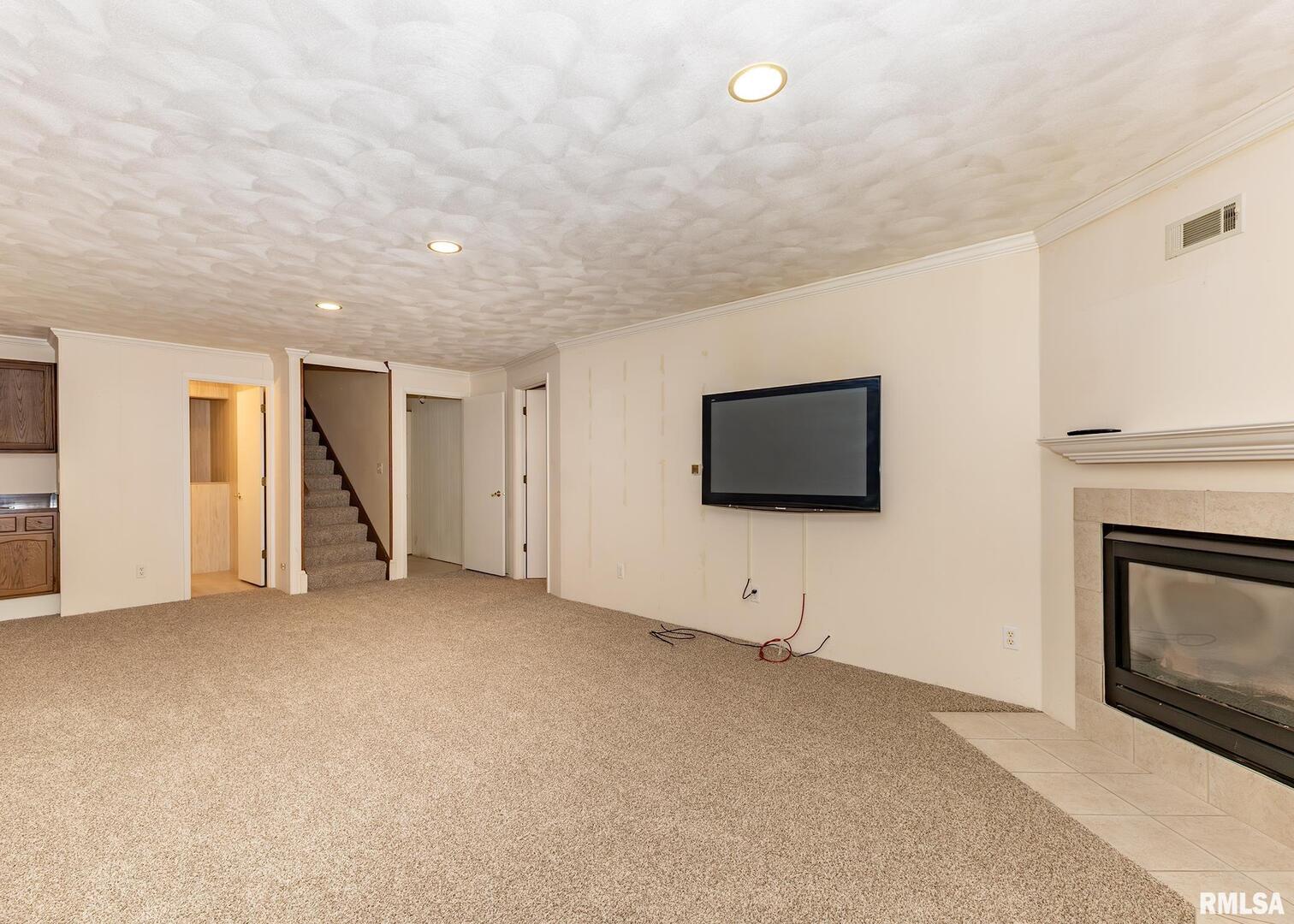 3407 41st Street Moline, IL 61265 - Photo 18 of 25 a view of an empty room with window and fireplace