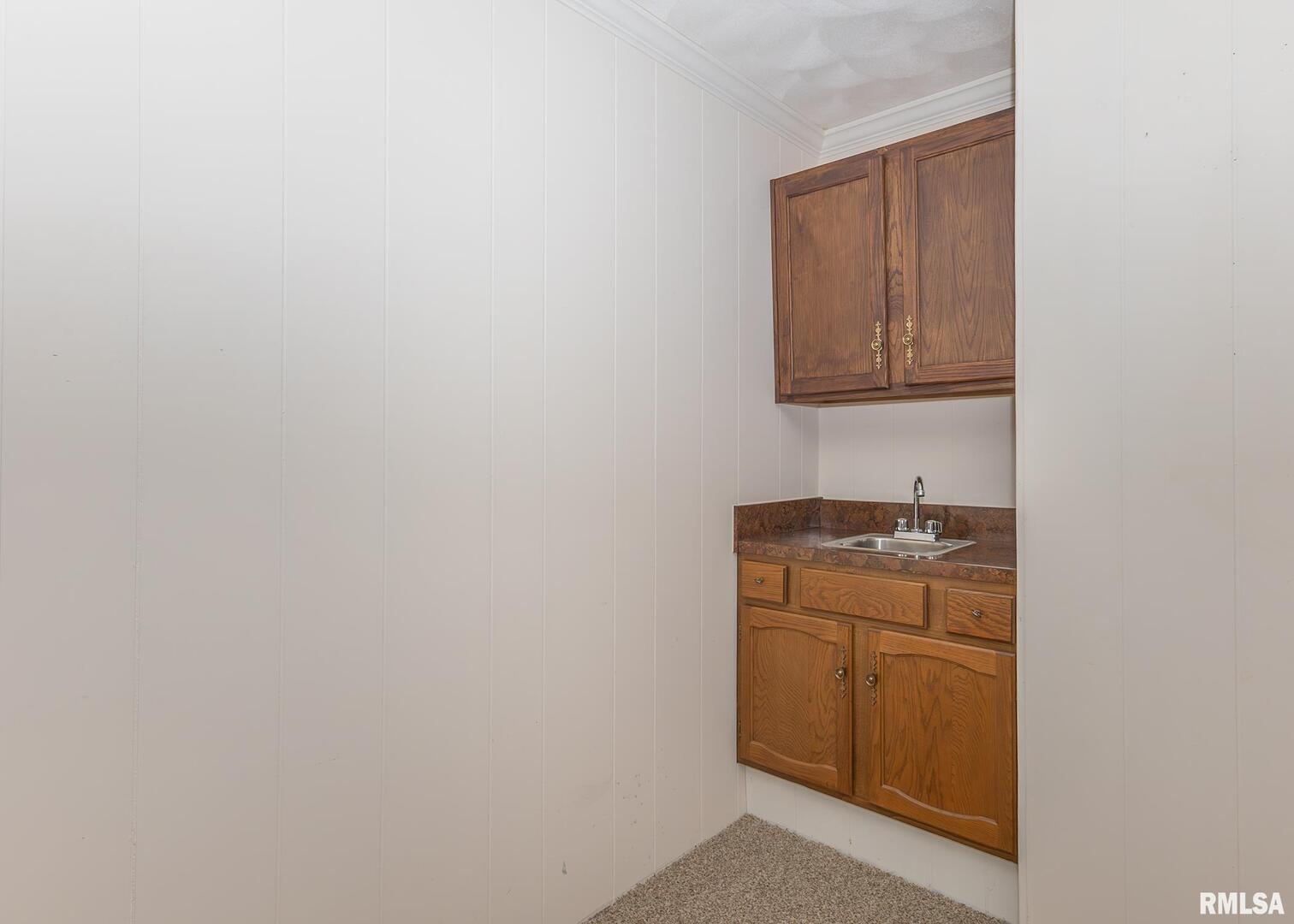 3407 41st Street Moline, IL 61265 - Photo 19 of 25 a bathroom with a sink and a mirror
