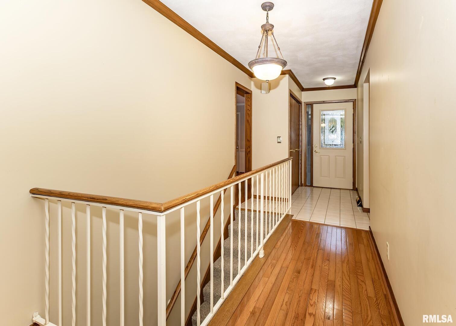3407 41st Street Moline, IL 61265 - Photo 3 of 25 a view of entryway with wooden floor
