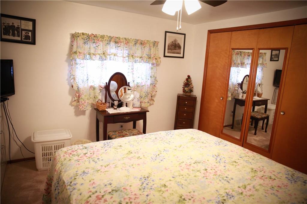 411 Reservoir Road Dunbar, PA 15431 - Photo 11 of 18 a bedroom with a bed and a mirror