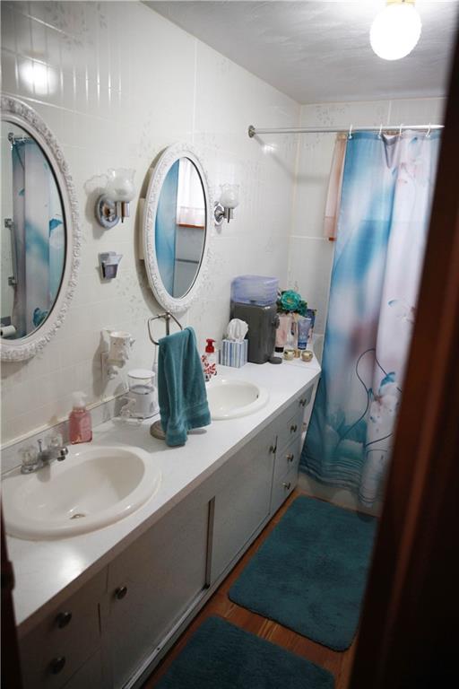411 Reservoir Road Dunbar, PA 15431 - Photo 13 of 18 a bathroom with a sink and a mirror