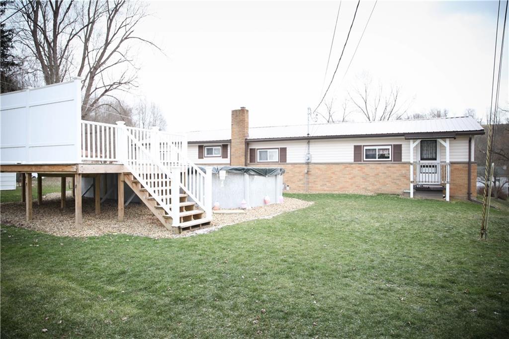 411 Reservoir Road Dunbar, PA 15431 - Photo 2 of 18 a view of a house with a backyard porch and sitting area