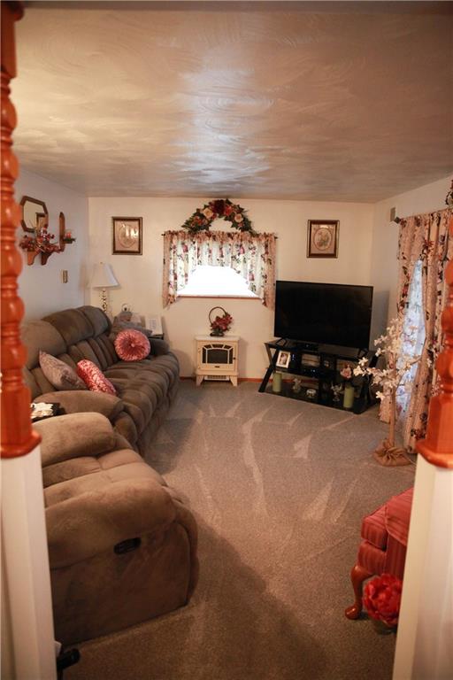 411 Reservoir Road Dunbar, PA 15431 - Photo 5 of 18 a living room with furniture a window and a flat screen tv