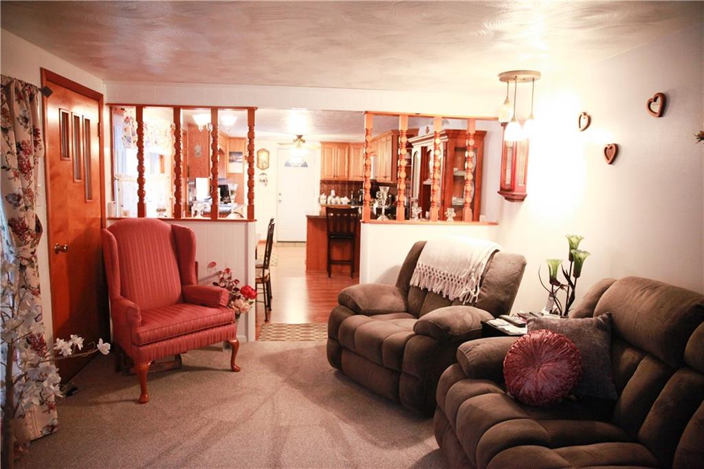 411 Reservoir Road Dunbar, PA 15431 - Photo 6 of 18 a living room with furniture and a large window