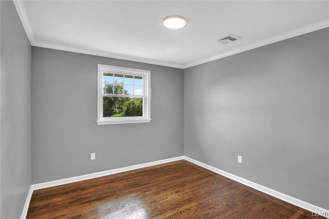 760 Carney Road Kunkletown, PA 18058 - Photo 16 of 36 a view of an empty room with wooden floor and a window