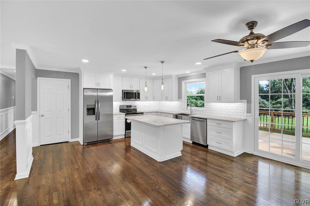 760 Carney Road Kunkletown, PA 18058 - Photo 6 of 36 a kitchen with kitchen island white cabinets and stainless steel appliances