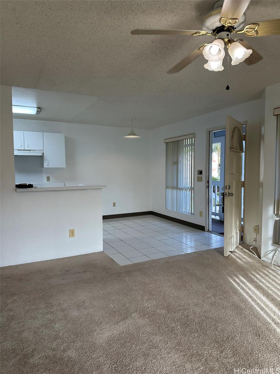 94-209 Lumiaina Place, Unit J203 Waipahu, HI 96797 - Photo 1 of 19 a view of an empty room with a window
