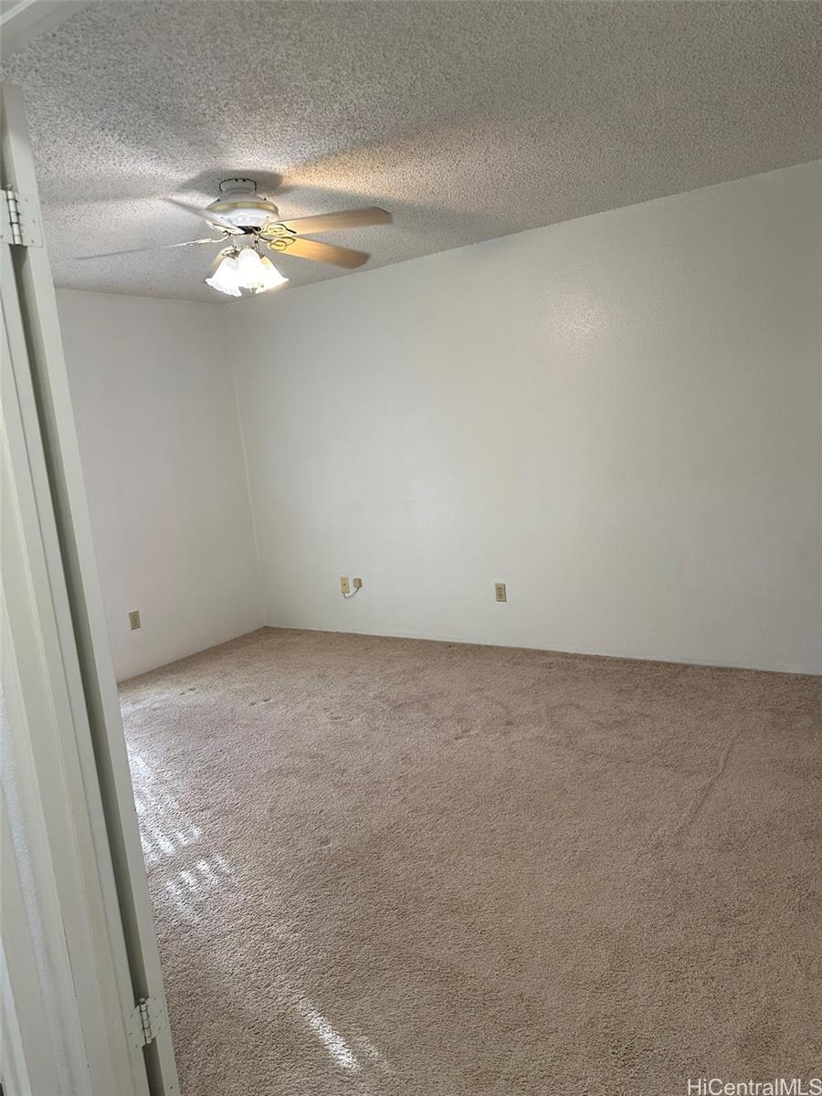94-209 Lumiaina Place, Unit J203 Waipahu, HI 96797 - Photo 11 of 19 a view of an empty room