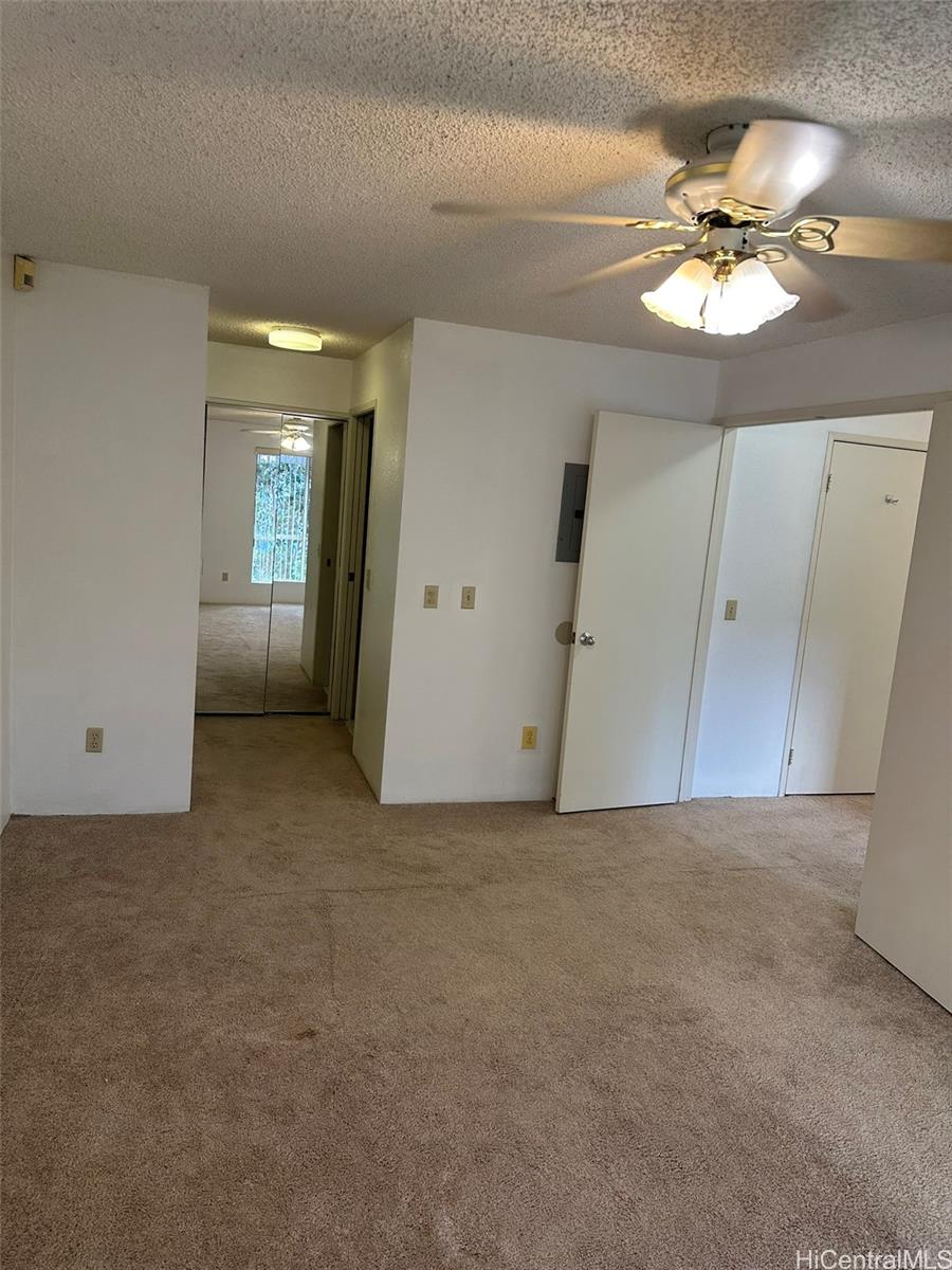 94-209 Lumiaina Place, Unit J203 Waipahu, HI 96797 - Photo 12 of 19 a view of a chandelier in a room