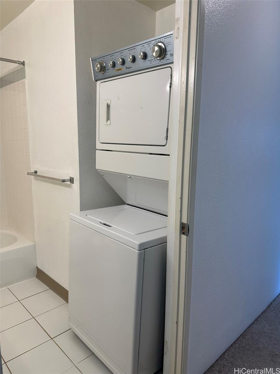 94-209 Lumiaina Place, Unit J203 Waipahu, HI 96797 - Photo 7 of 19 a utility room with dryer and washer