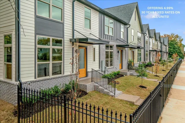 a balcony with table and chairs