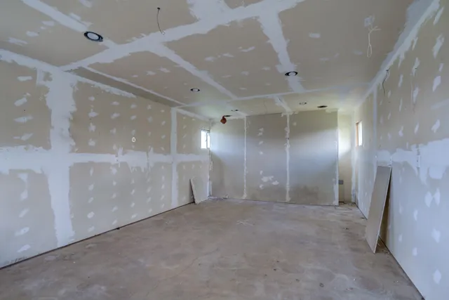 a bathroom with a toilet and shower