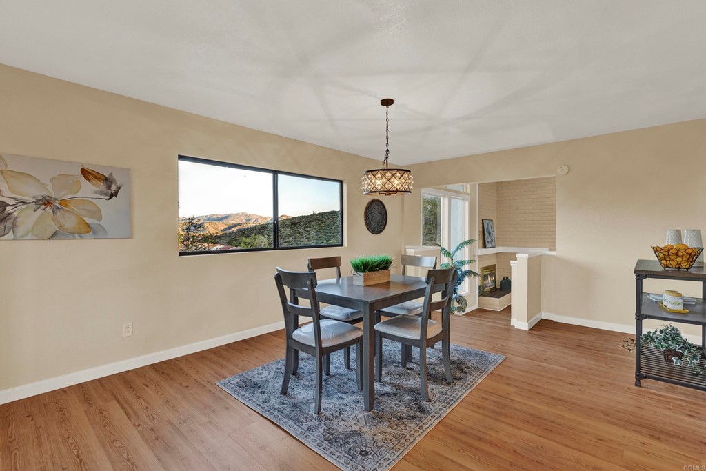 12032 Serena Road Lakeside, CA 92040 - Photo 18 of 55 a view of a dining room with furniture window and wooden floor