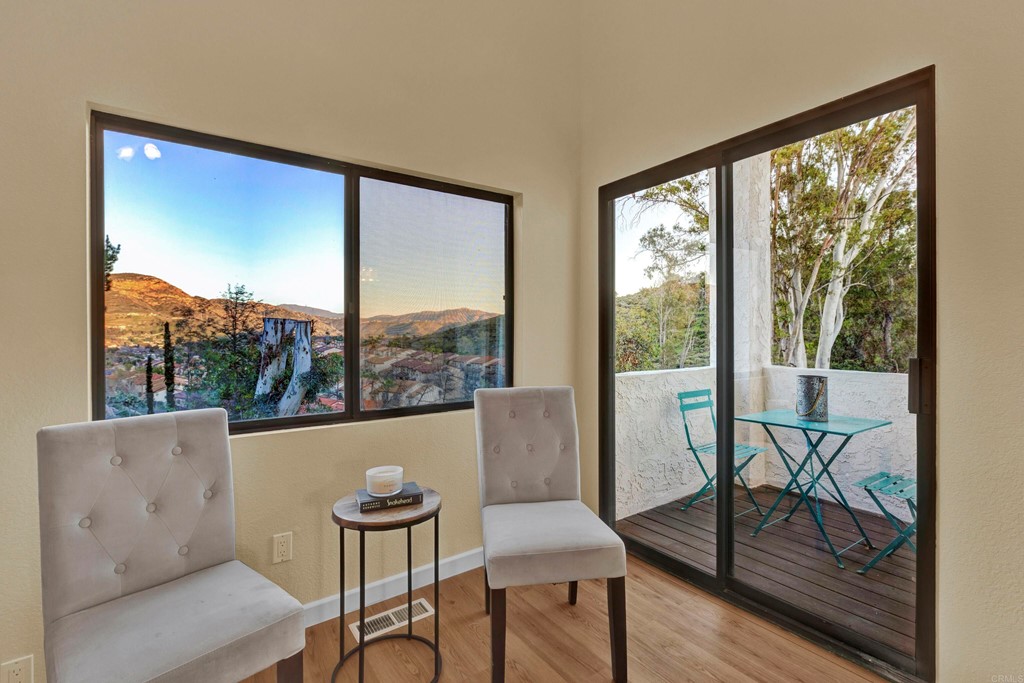 12032 Serena Road Lakeside, CA 92040 - Photo 29 of 55 a living room with furniture and a floor to ceiling window