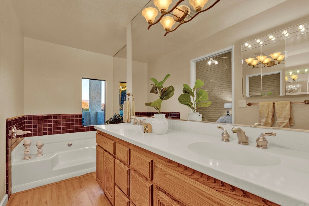 12032 Serena Road Lakeside, CA 92040 - Photo 33 of 55 a bathroom with a sink and a mirror