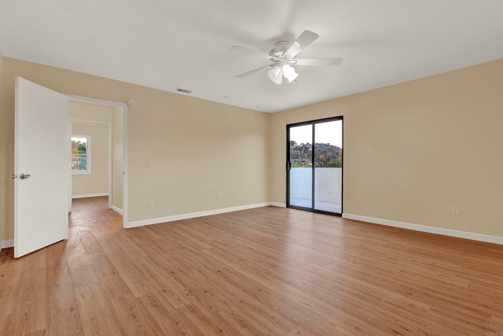 12032 Serena Road Lakeside, CA 92040 - Photo 41 of 55 a view of an empty room with wooden floor and a window