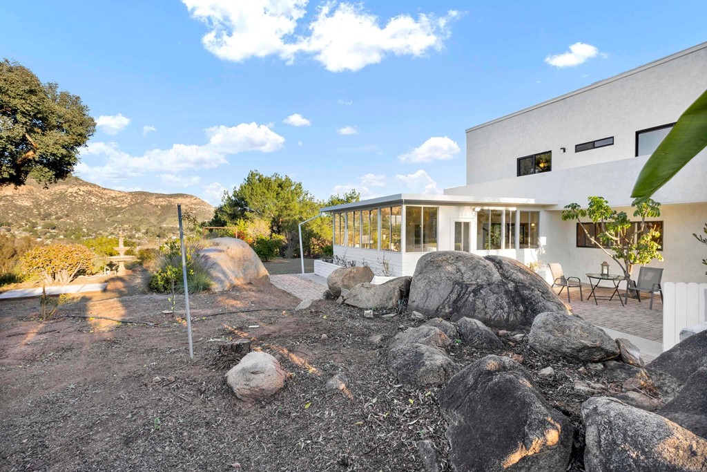 12032 Serena Road Lakeside, CA 92040 - Photo 53 of 55 a front view of a house with a yard