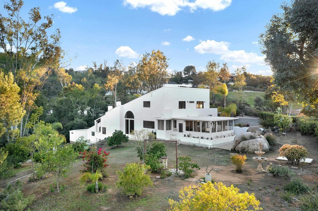 12032 Serena Road Lakeside, CA 92040 - Photo 7 of 55 a view of a house with a yard and garden