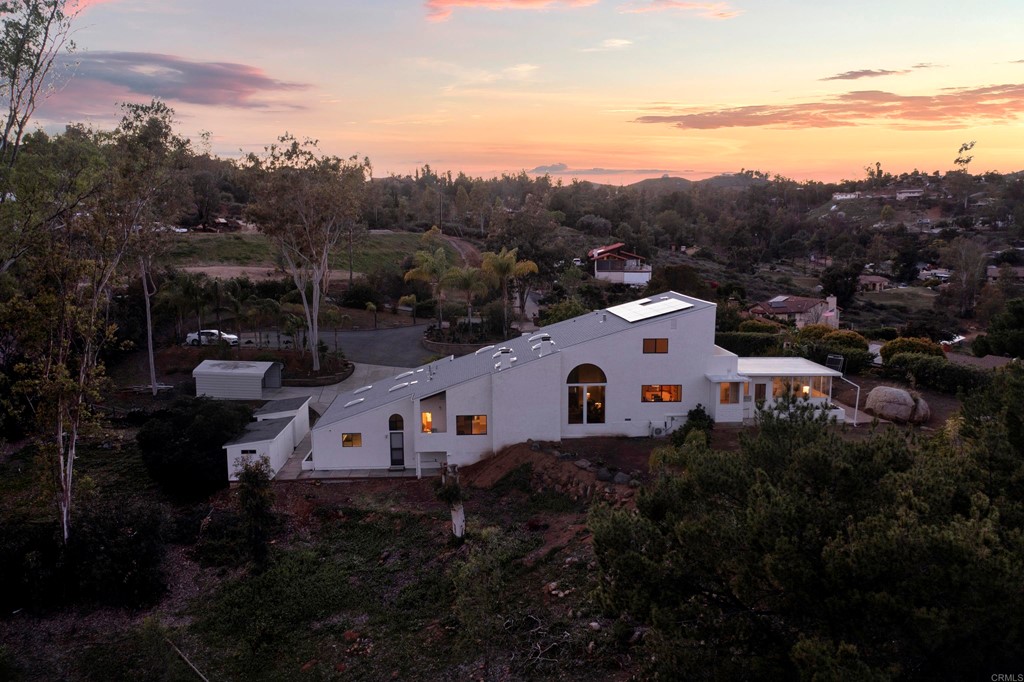 12032 Serena Road Lakeside, CA 92040 - Photo 10 of 55 a white house that has tree in front of it