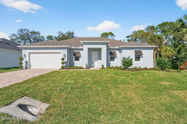 front view of a house with a yard