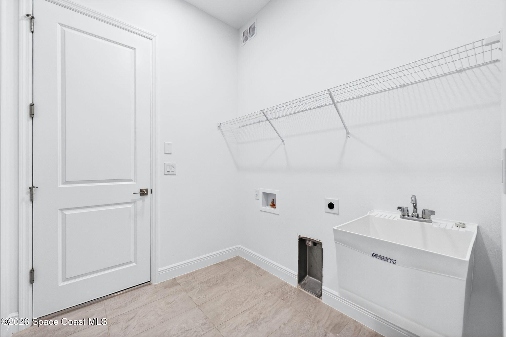 7480 Sheridan Road West Melbourne, FL 32904 - Photo 28 of 32 Large Laundry w/ Sink