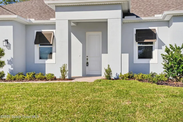 a view of a kitchen with wooden floor