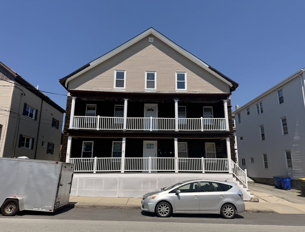 630 Maple Street Fall River, MA 02720 - Photo 2 of 4 a car parked in front of a house