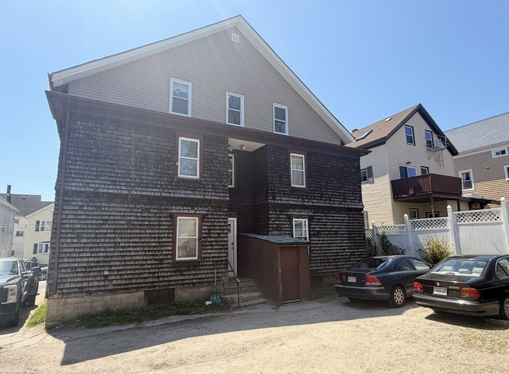 630 Maple Street Fall River, MA 02720 - Photo 3 of 4 a front view of a house with cars parked