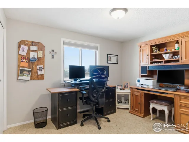a view of a workspace with furniture