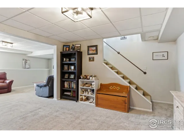 a bedroom with furniture and baby crib