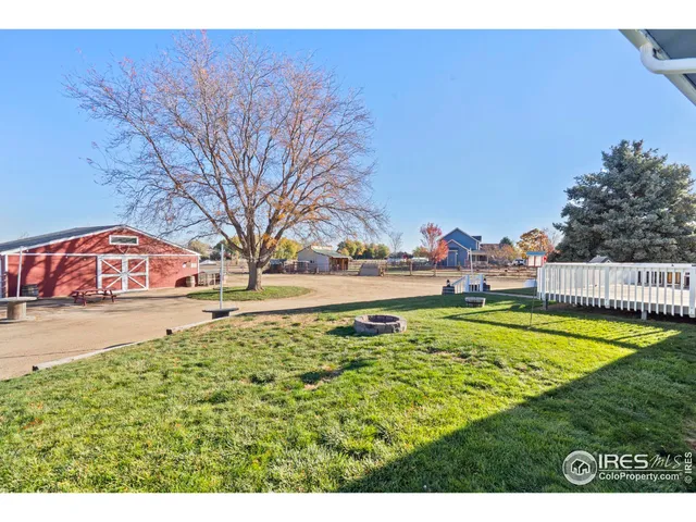 a view of a swimming pool with an outdoor space and seating area