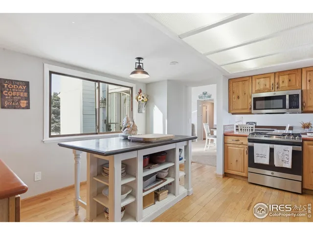 a kitchen with a stove a sink and a refrigerator
