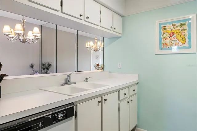 a kitchen with a refrigerator and a stove