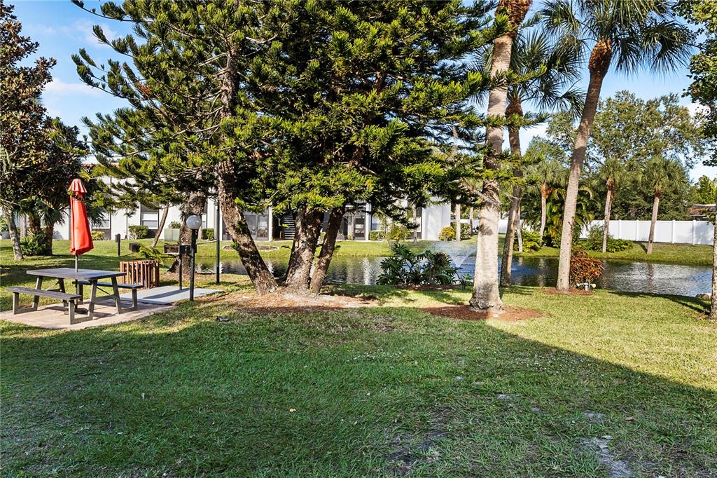 3273 South Beneva Road, Unit 203 Sarasota, FL 34232 - Photo 16 of 36 a view of a park with large trees