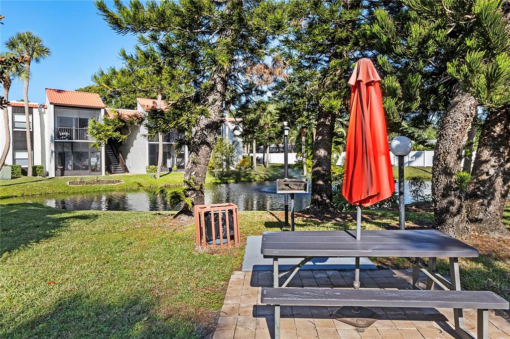 3273 South Beneva Road, Unit 203 Sarasota, FL 34232 - Photo 22 of 36 a view of a backyard with sitting area and furniture