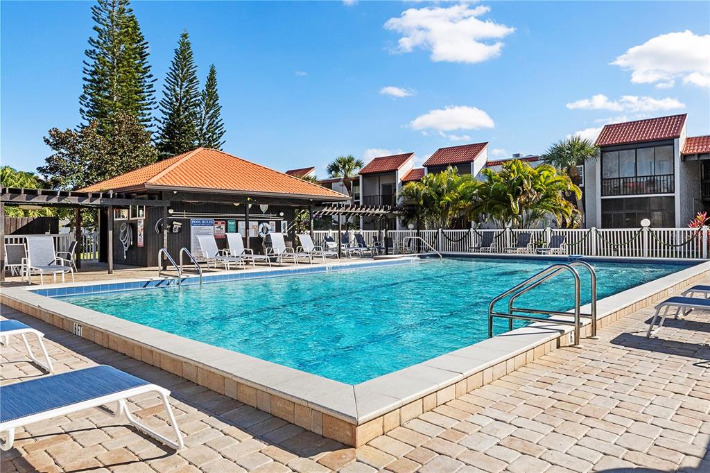 3273 South Beneva Road, Unit 203 Sarasota, FL 34232 - Photo 24 of 36 a view of a house with a swimming pool