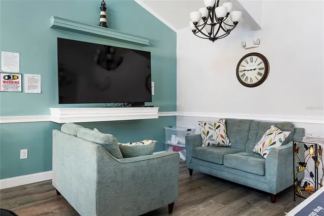 a view of a wooden house with a large window and table