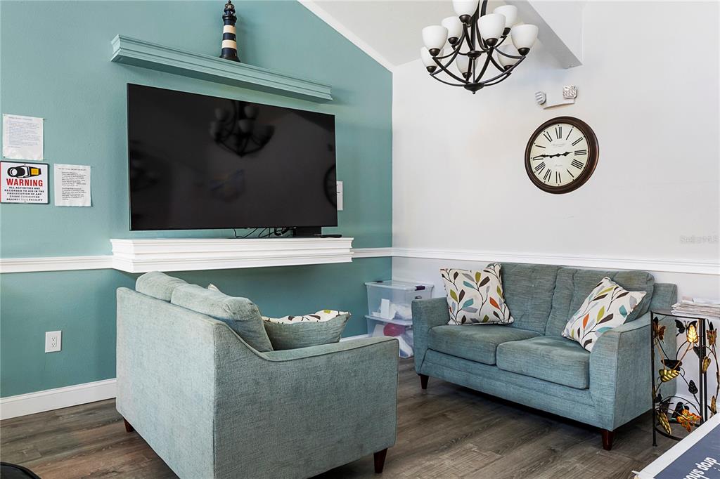 3273 South Beneva Road, Unit 203 Sarasota, FL 34232 - Photo 29 of 36 a living room with furniture and a wall painting