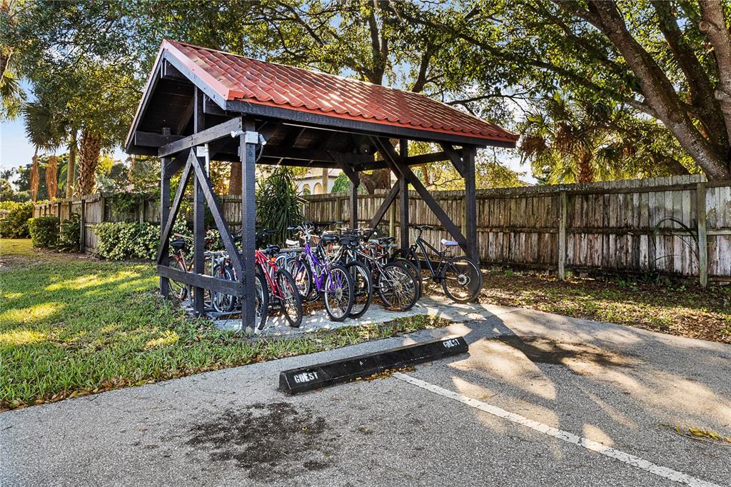 3273 South Beneva Road, Unit 203 Sarasota, FL 34232 - Photo 30 of 36 a view of a wooden house with a large window and table