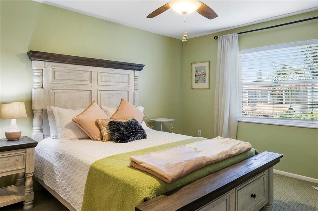 3273 South Beneva Road, Unit 203 Sarasota, FL 34232 - Photo 5 of 36 a bedroom with a bed and a window